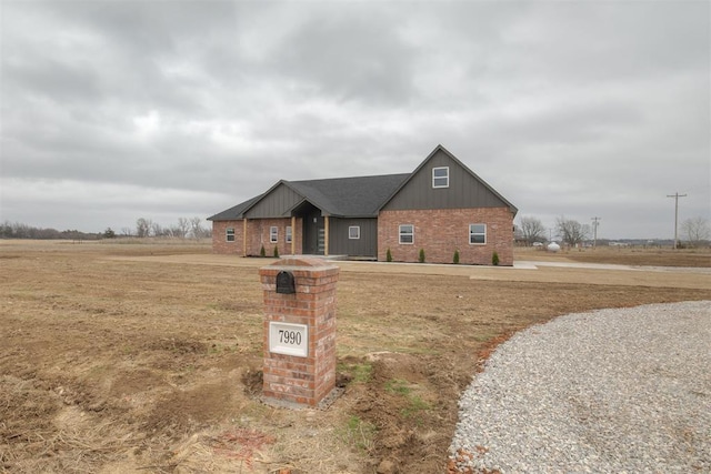 view of front of house featuring brick siding