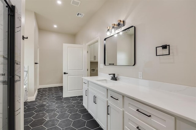 bathroom with recessed lighting, vanity, visible vents, and baseboards