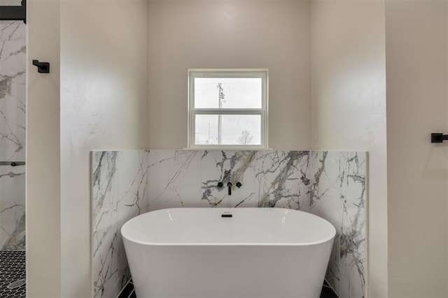 full bathroom featuring a freestanding tub