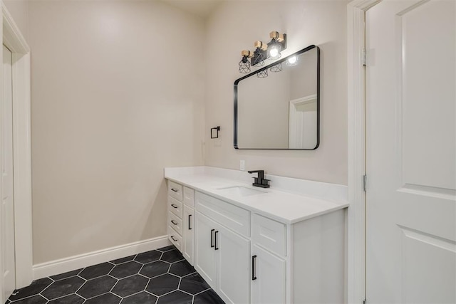 bathroom with baseboards and vanity