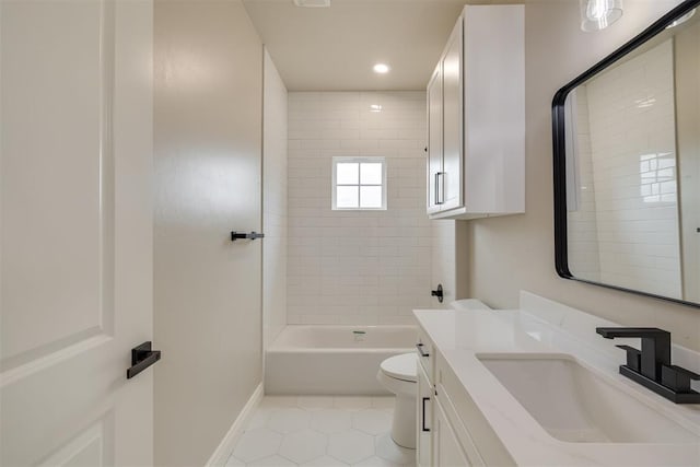 bathroom with baseboards, toilet, tile patterned flooring, tub / shower combination, and vanity