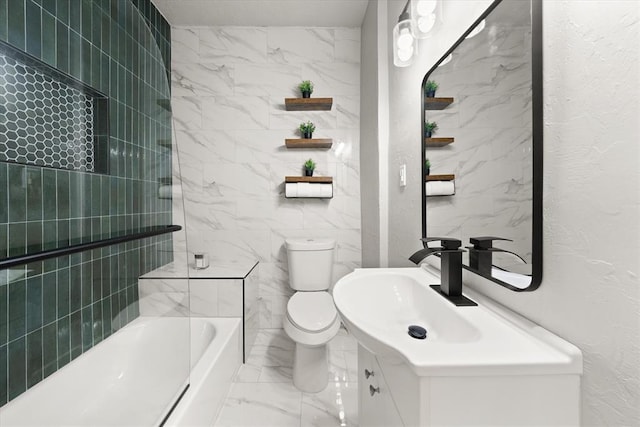 bathroom with shower / bathtub combination, toilet, vanity, tile walls, and marble finish floor