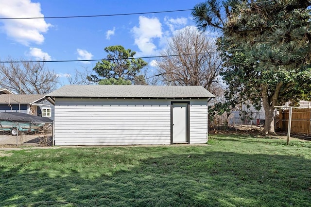 view of shed with fence