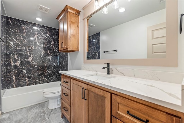 bathroom with visible vents, shower / bath combination, vanity, and toilet