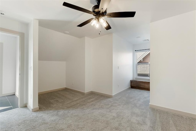 bonus room featuring carpet floors, visible vents, baseboards, and a ceiling fan