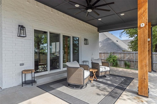 view of patio featuring fence and a ceiling fan