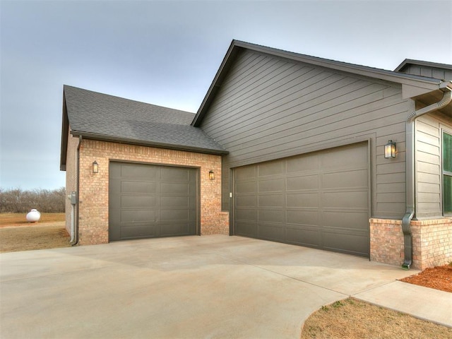 exterior space with concrete driveway