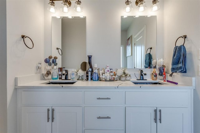 full bathroom featuring double vanity and a sink