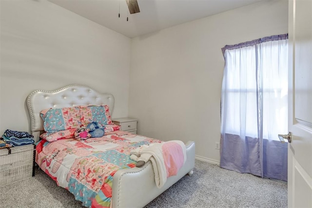 bedroom featuring baseboards, a ceiling fan, and carpet flooring