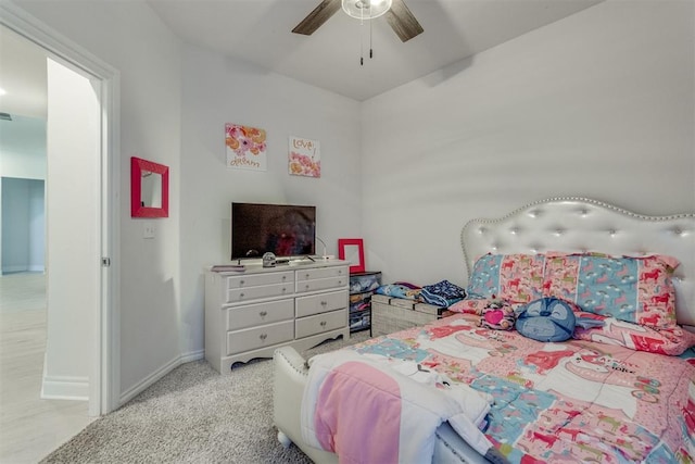 bedroom featuring carpet, a ceiling fan, and baseboards