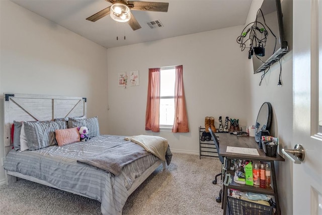 carpeted bedroom with a ceiling fan, visible vents, and baseboards