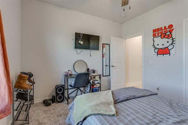 carpeted bedroom featuring ceiling fan and baseboards