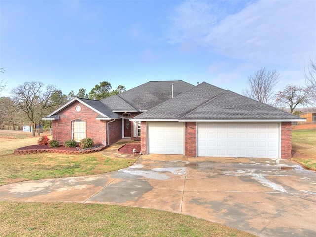 view of front of home featuring brick siding, a shingled roof, concrete driveway, a garage, and a front lawn