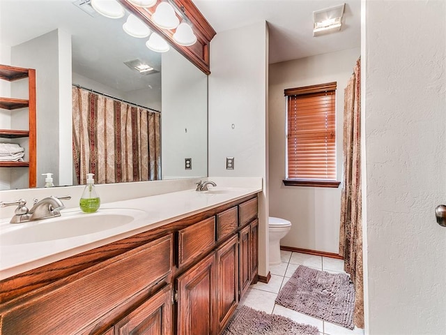 full bath featuring tile patterned flooring, a sink, toilet, and double vanity