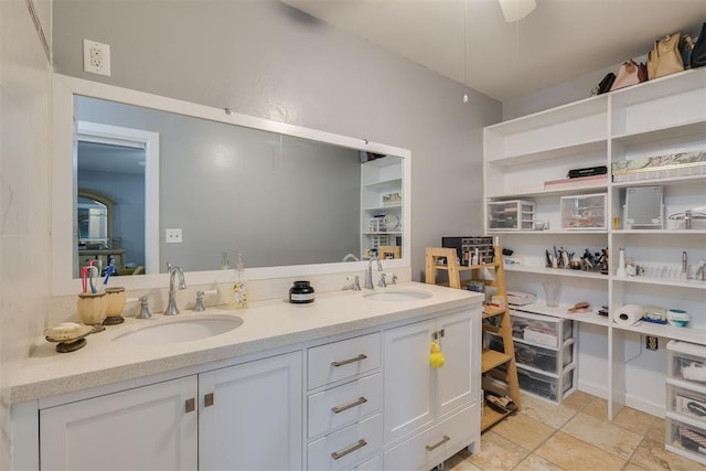 full bathroom featuring a sink and double vanity