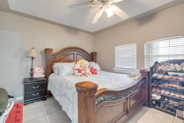 bedroom featuring ceiling fan and light tile patterned flooring