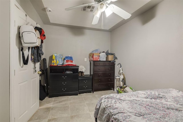 bedroom featuring light tile patterned floors, ceiling fan, and visible vents