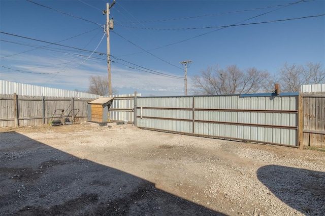 view of yard featuring fence private yard and a gate