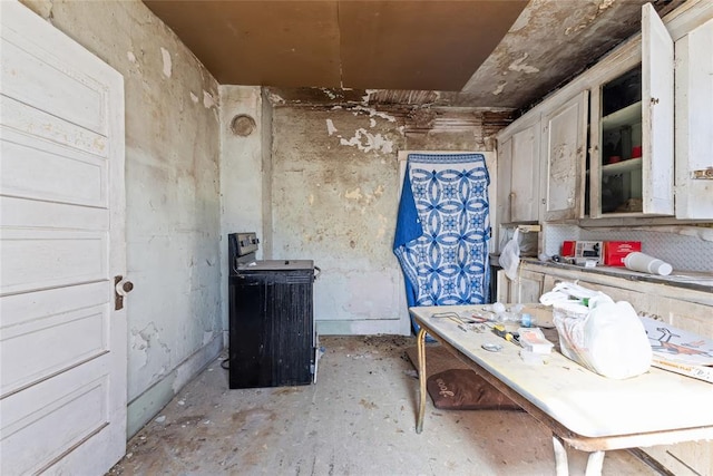 kitchen with unfinished concrete flooring