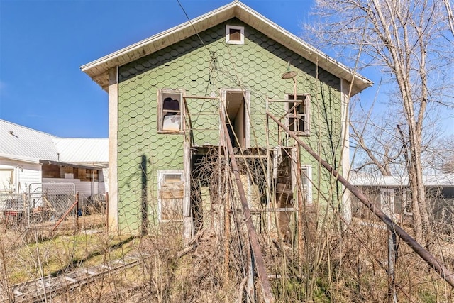 view of outbuilding with fence