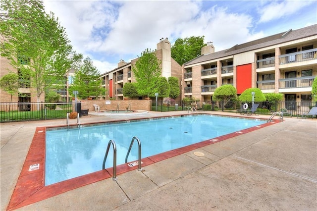 view of pool with fence