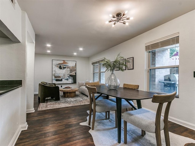 dining area with dark wood finished floors, a wealth of natural light, and baseboards