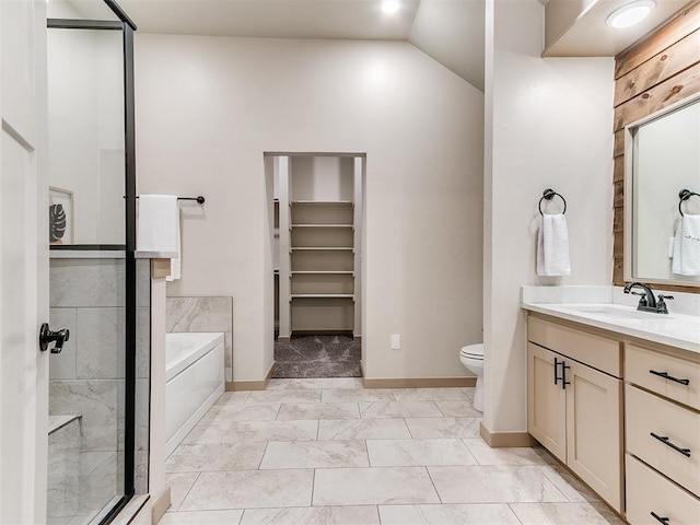 full bath featuring a stall shower, toilet, marble finish floor, vanity, and a bath