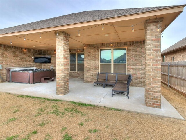 view of patio / terrace featuring fence