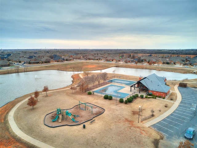 bird's eye view with a water view and a residential view