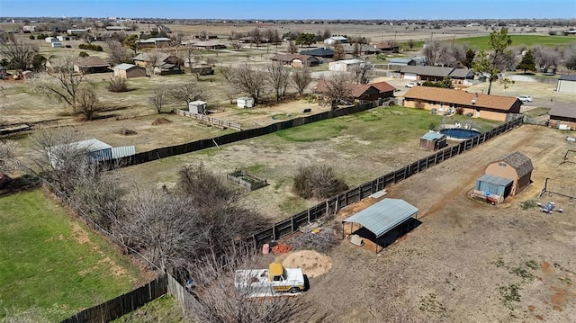 birds eye view of property featuring a rural view