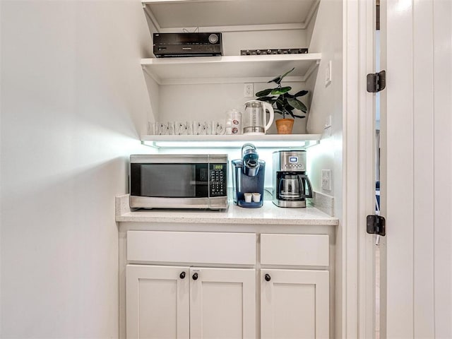 bar featuring stainless steel microwave