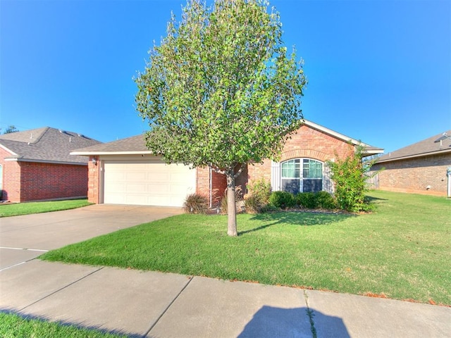 view of front of home with a front yard, brick siding, concrete driveway, and an attached garage