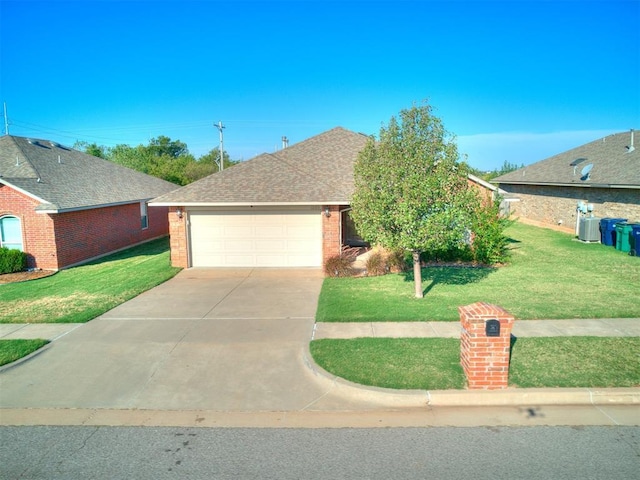 view of front of house with brick siding, a shingled roof, a front lawn, a garage, and driveway