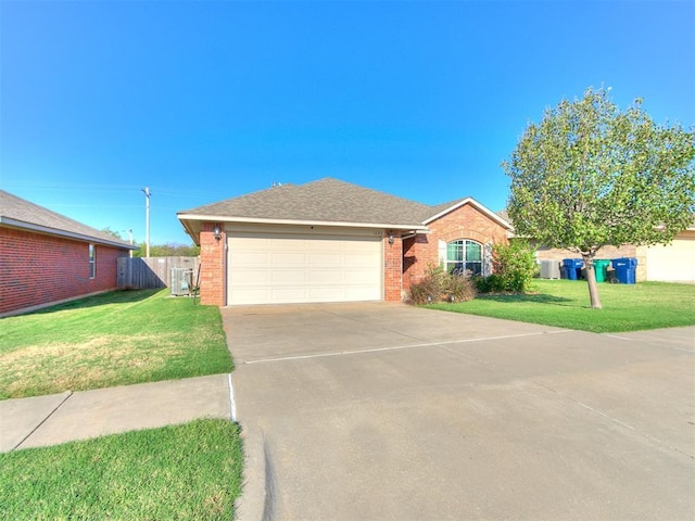 single story home featuring fence, concrete driveway, a front yard, a garage, and brick siding