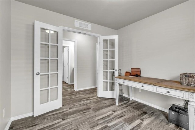 office area featuring visible vents, french doors, baseboards, and wood finished floors