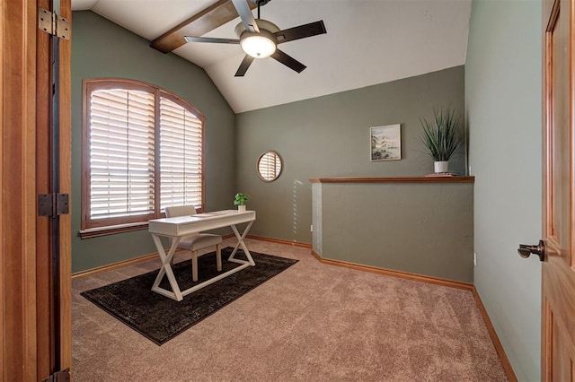 carpeted office space with baseboards, a ceiling fan, and vaulted ceiling