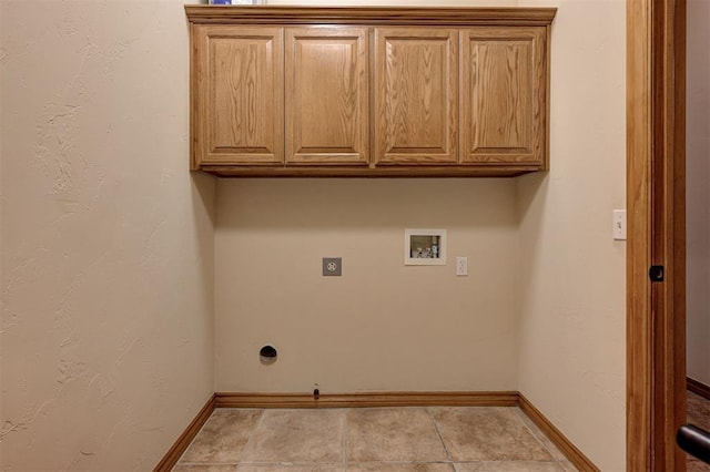 washroom featuring electric dryer hookup, baseboards, cabinet space, and hookup for a washing machine