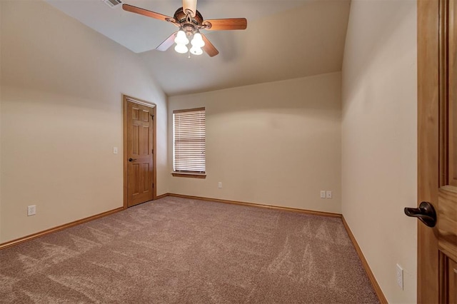 carpeted empty room featuring visible vents, baseboards, lofted ceiling, and a ceiling fan