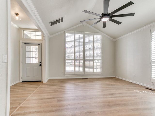 foyer with ornamental molding, visible vents, and light wood-style flooring