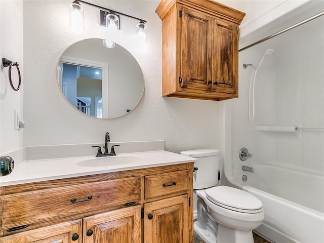 full bathroom featuring toilet, a textured wall, shower / bathing tub combination, and vanity