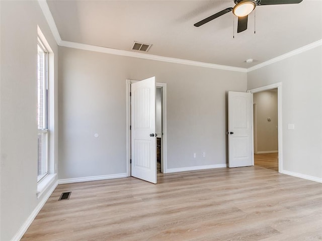 unfurnished bedroom featuring light wood-style flooring, visible vents, and baseboards