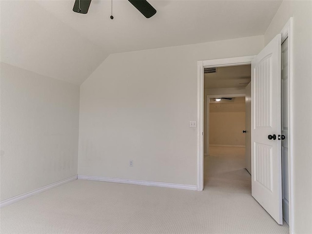 bonus room featuring light carpet, a ceiling fan, visible vents, vaulted ceiling, and baseboards