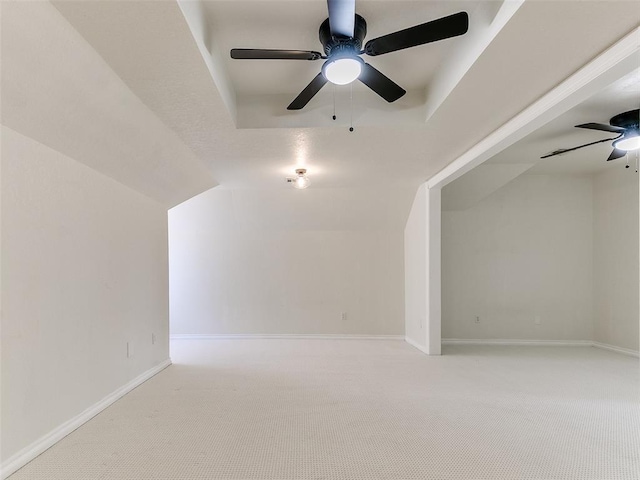 bonus room with carpet floors, ceiling fan, baseboards, and vaulted ceiling