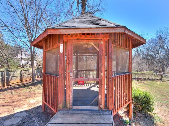 view of outdoor structure featuring fence