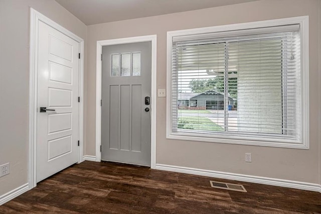 entryway featuring baseboards, visible vents, and dark wood-style flooring