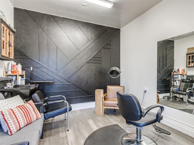 home office featuring wood finished floors and baseboards