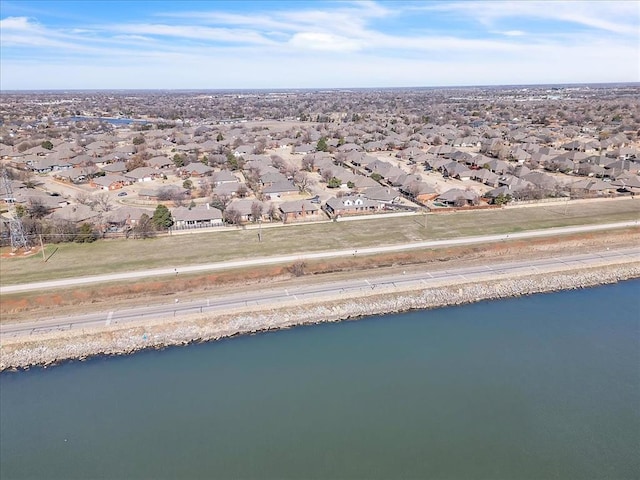 bird's eye view featuring a water view and a residential view