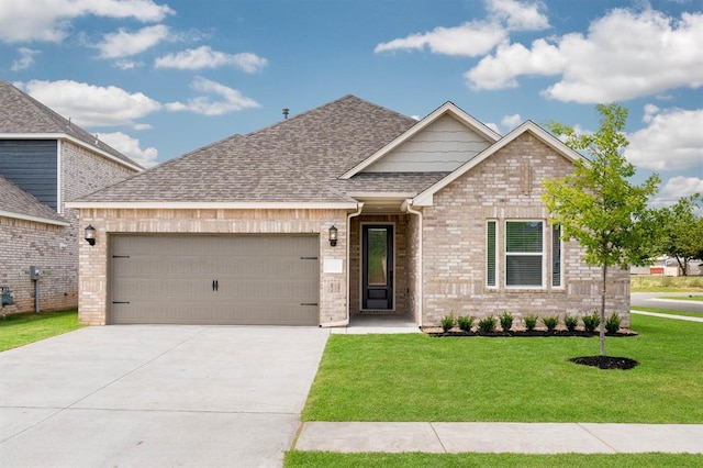 view of front facade with an attached garage, brick siding, a shingled roof, concrete driveway, and a front yard