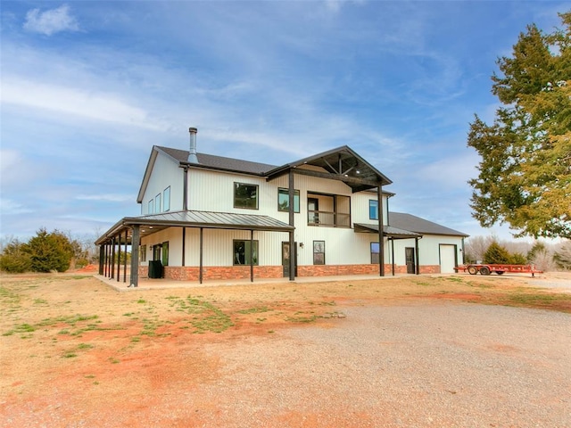 view of front of property with metal roof and a standing seam roof