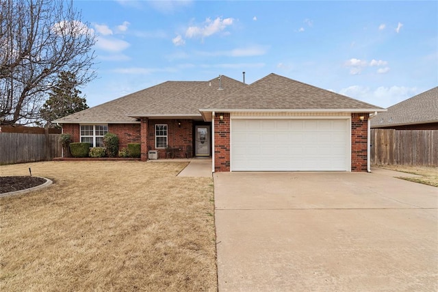 single story home featuring roof with shingles, brick siding, driveway, and fence